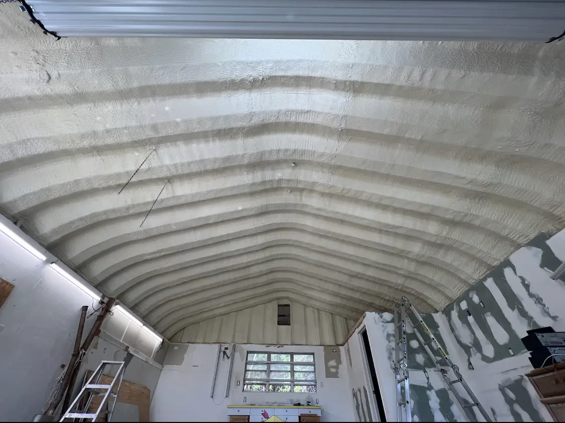 Spray polyurethane foam applied to the underside of a metal roof deck in Hampstead